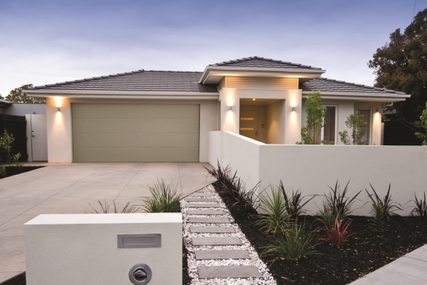 Driveway and facade of a contemporary rendered australian home